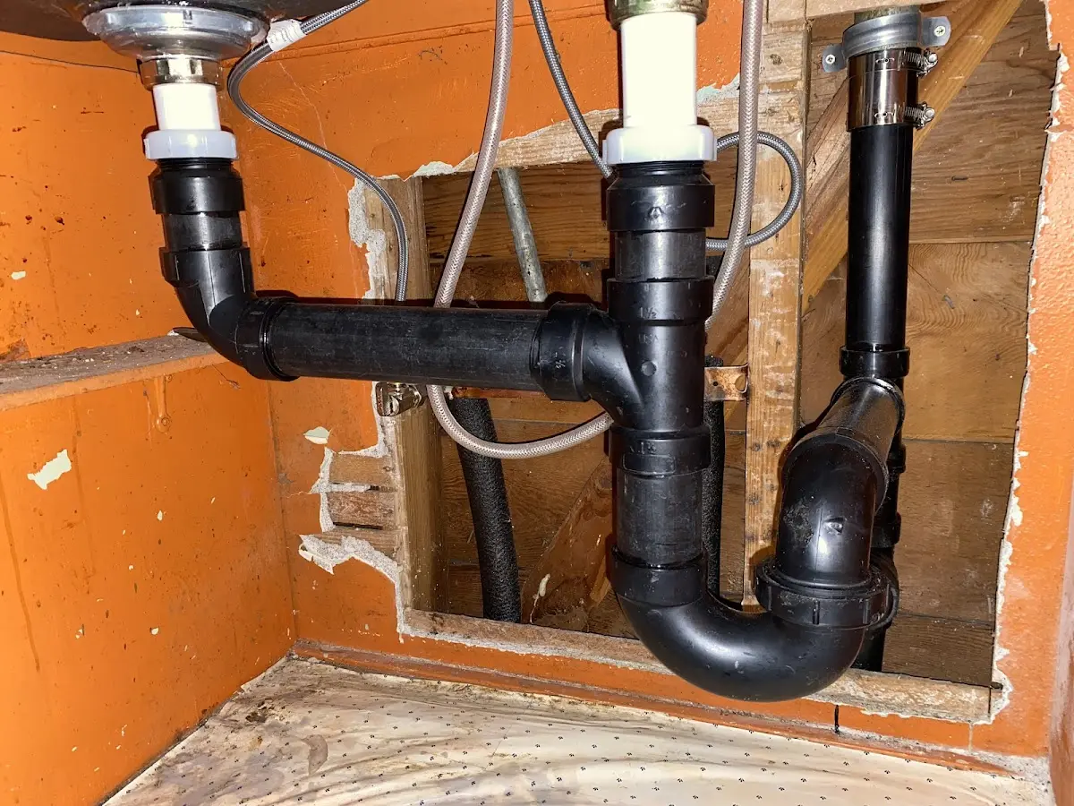 Professional Garbage Disposal Repair equipment and tools on the job in Prosper